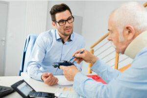 Palm Bay car accident lawyer meeting with injured senior man