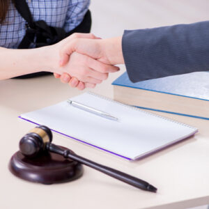 Melbourne workers' compensation lawyer shaking hands with injured client