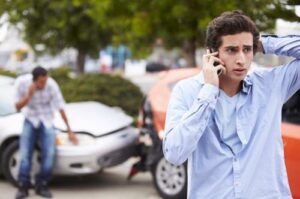 A man calling a Palm Bay car accident lawyer after being in a rear-end car accident.