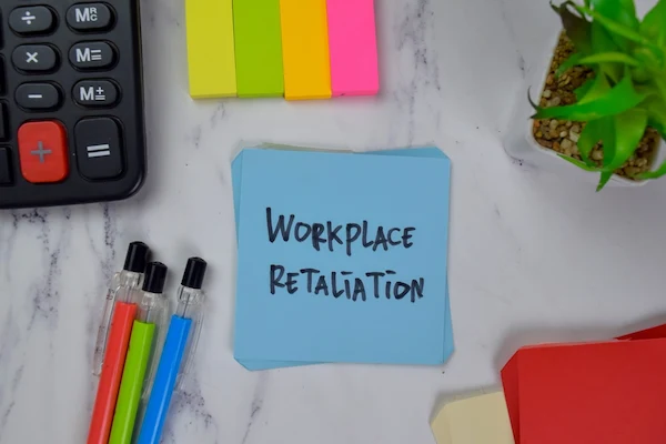 workplace retaliation written on a note symbolizes workers’ comp retaliation in Florida.